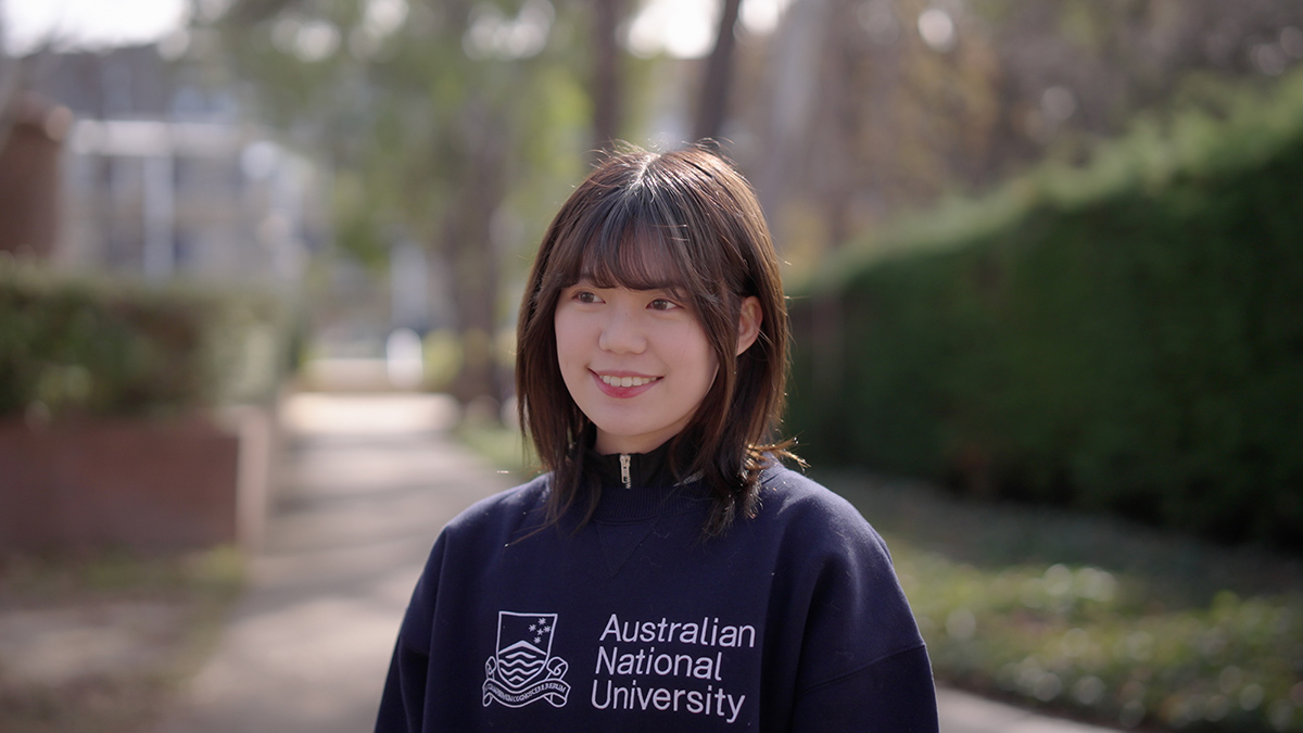 ANU student Victoria Yeung looks off to the side on the ANU campus. 