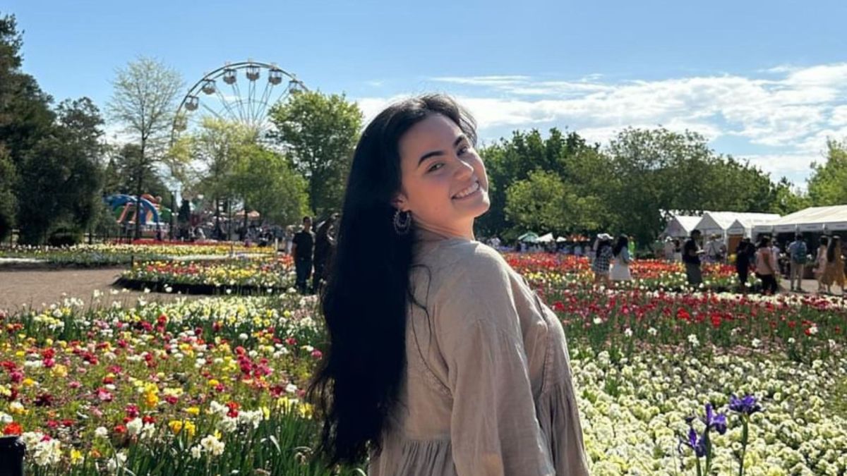 Hana smiling at Floriade flower festival in Canberra. 