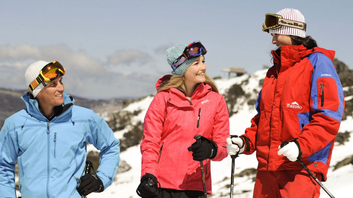 Three people on the snow slopes at Thredbo Resort in New South Wales. 
