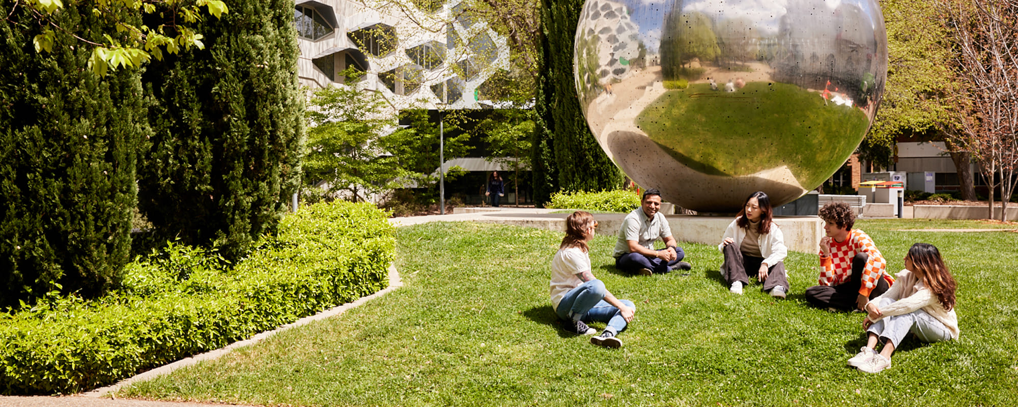Five ANU students sitting in front of the UNA